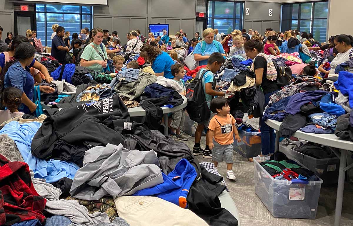 Crowd of students and parents looking through clothing at Ready Fest 2023.